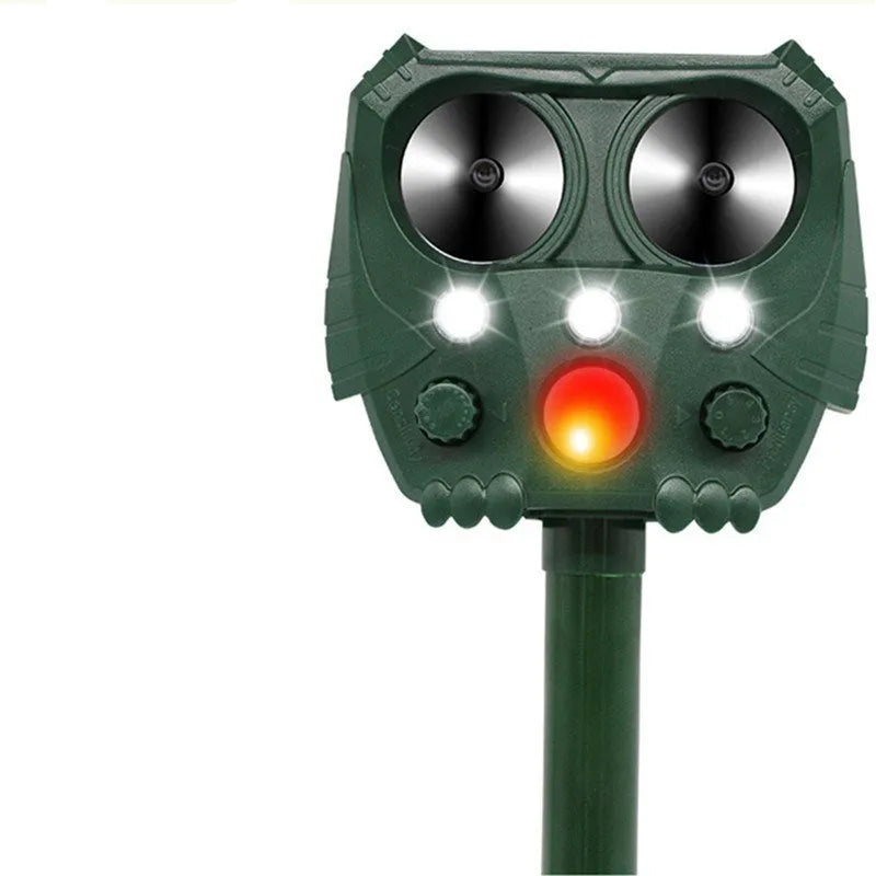 Green solar-powered ultrasonic animal repeller with motion sensor for outdoor pest control.