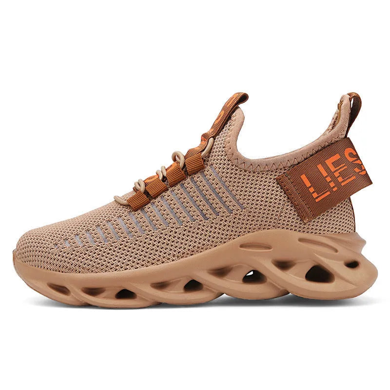 Children's Velcro sneakers in black, khaki, or white with fabric upper and textured sole.