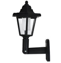 Black hexagonal solar-powered LED wall light with light sensor for outdoor garden use