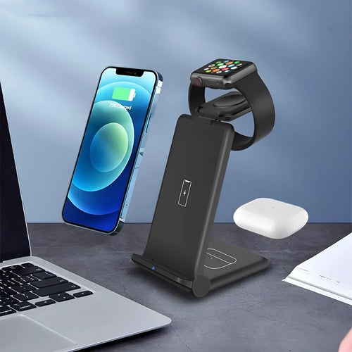 White 3-in-1 wireless charging station showing phone, Apple Watch and AirPods charging simultaneously on a desk.