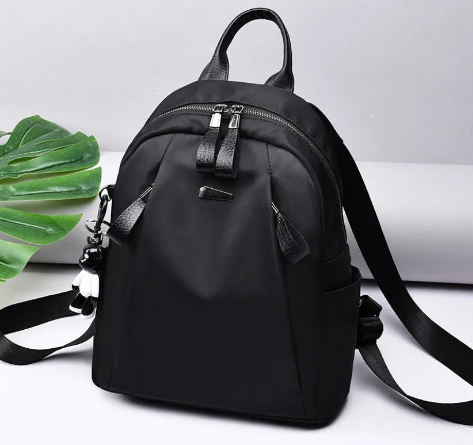 Medium Oxford cloth rucksack in wine red with double straps and interior phone pockets