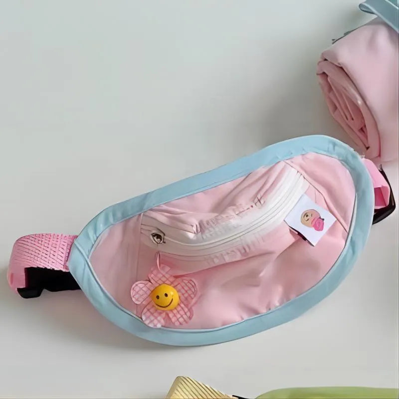 Powder blue messenger-style dog backpack for cats on a person's back, showing adjustable strap and poop bag holder.