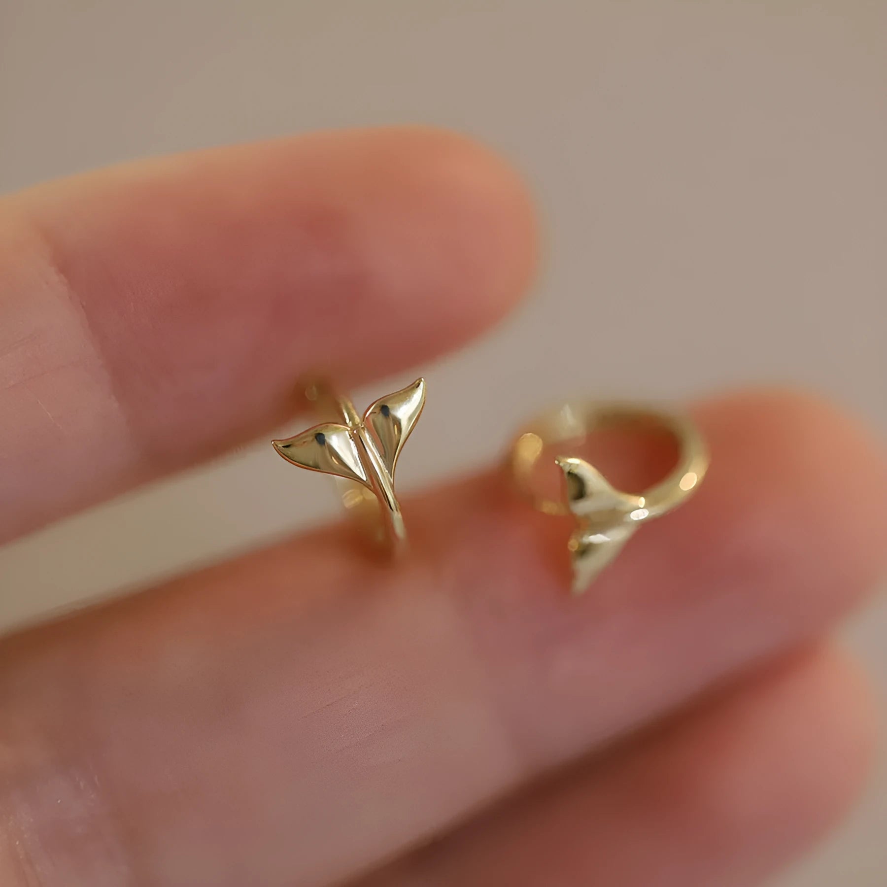 S925 Sterling Silver fishtail drop earrings in gold and white gold tone finishes.
