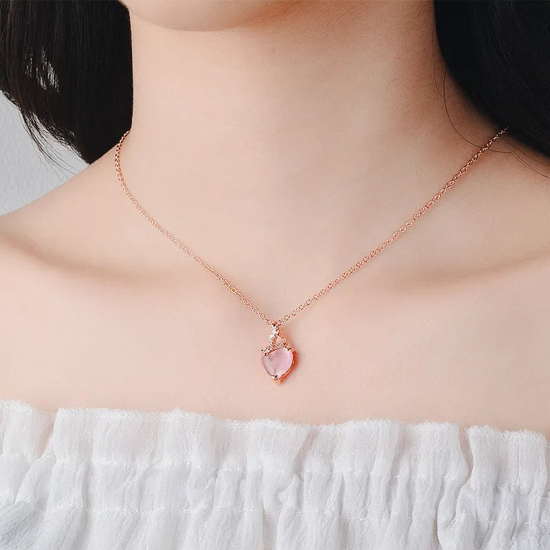 Women's heart-shaped pink crystal pendant necklace with rose gold cross chain