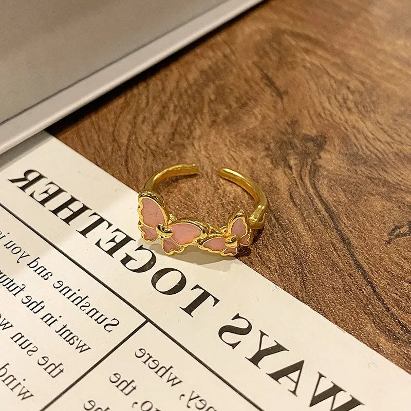 Butterfly women's copper ring with adjustable split ring design showing oil-drip colour treatment