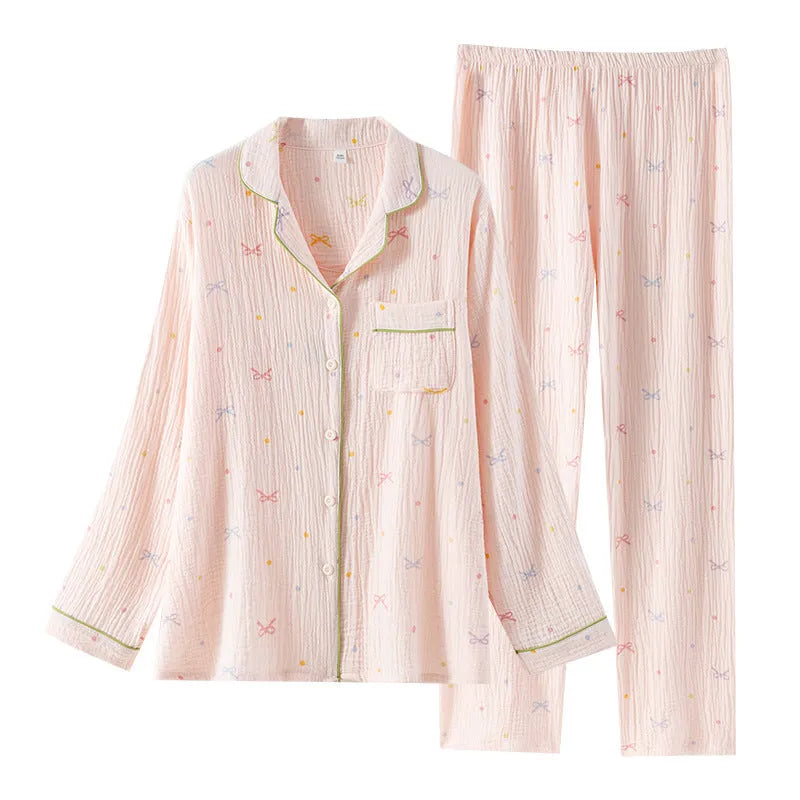 Women's beige cotton pajama set with long sleeves and full-length trousers for home lounging.