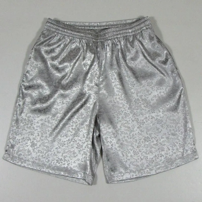 Men's black Tang suit-style elastic waist Tai Chi shorts laid flat.