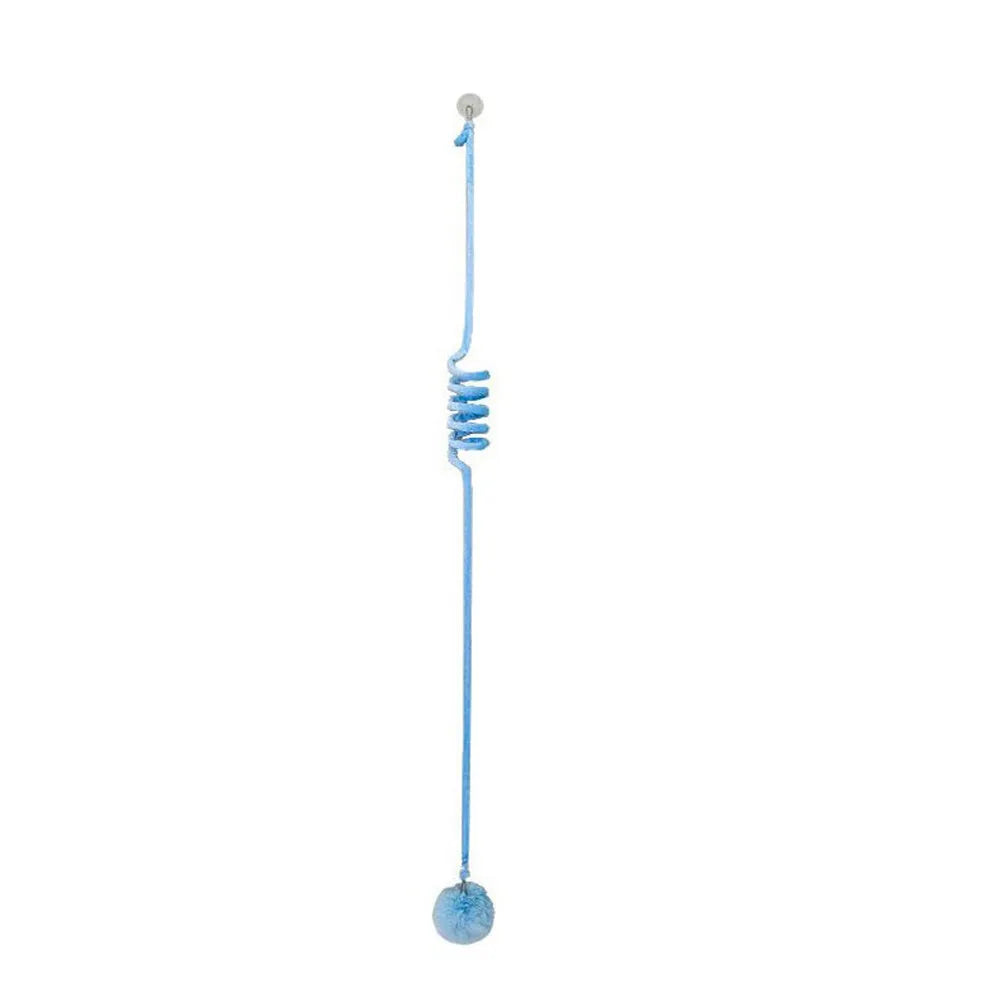 Colourful suction cup cat toy with spring wand and inflatable ball, hanging on a glass door