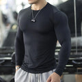 Men's black slim-fit long-sleeve fitness tights made from quick-dry nylon blend fabric.