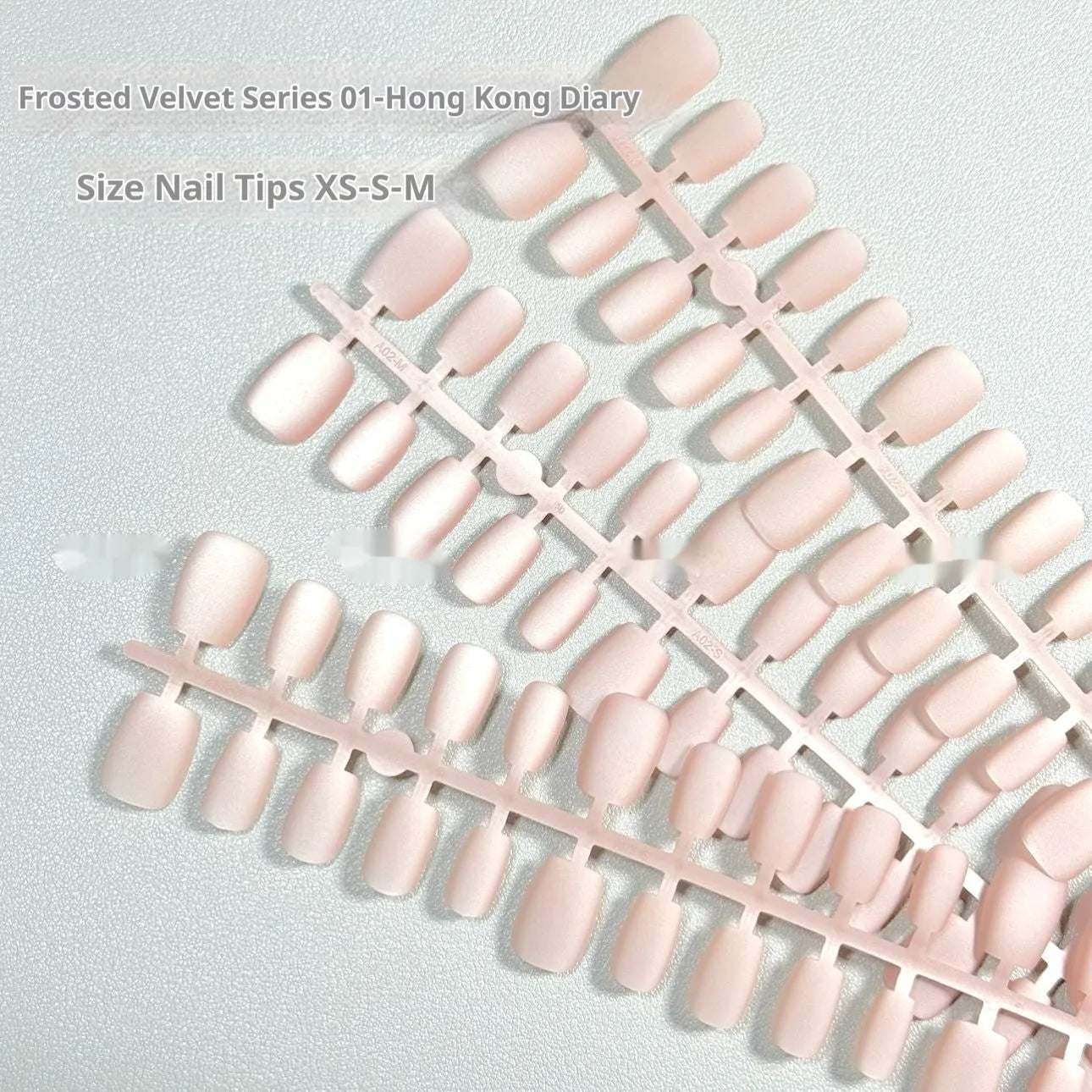 Frosted Velvet Cat's Eye false nail set showing electroplated design on short ladder sized PVC nails