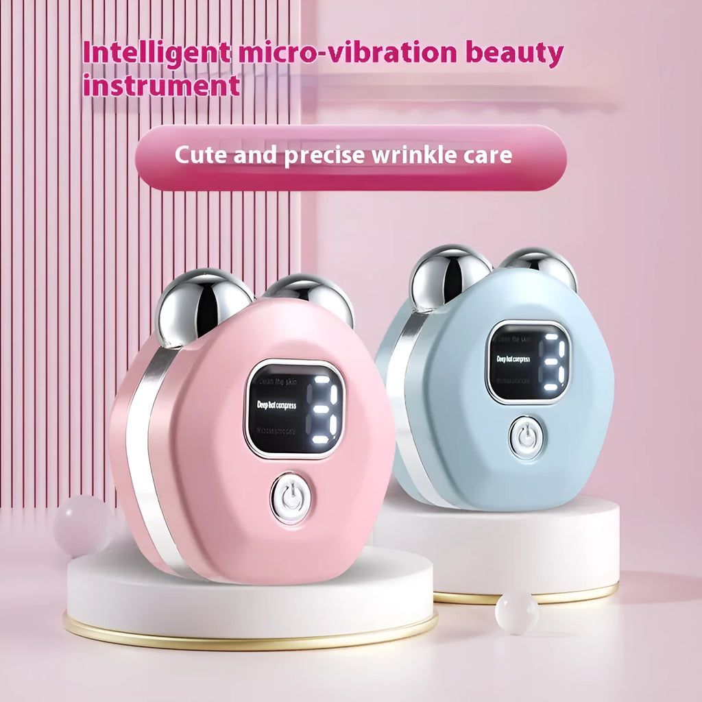 Portable white handheld facial massager with dual rollers and hot compress function on a pink background