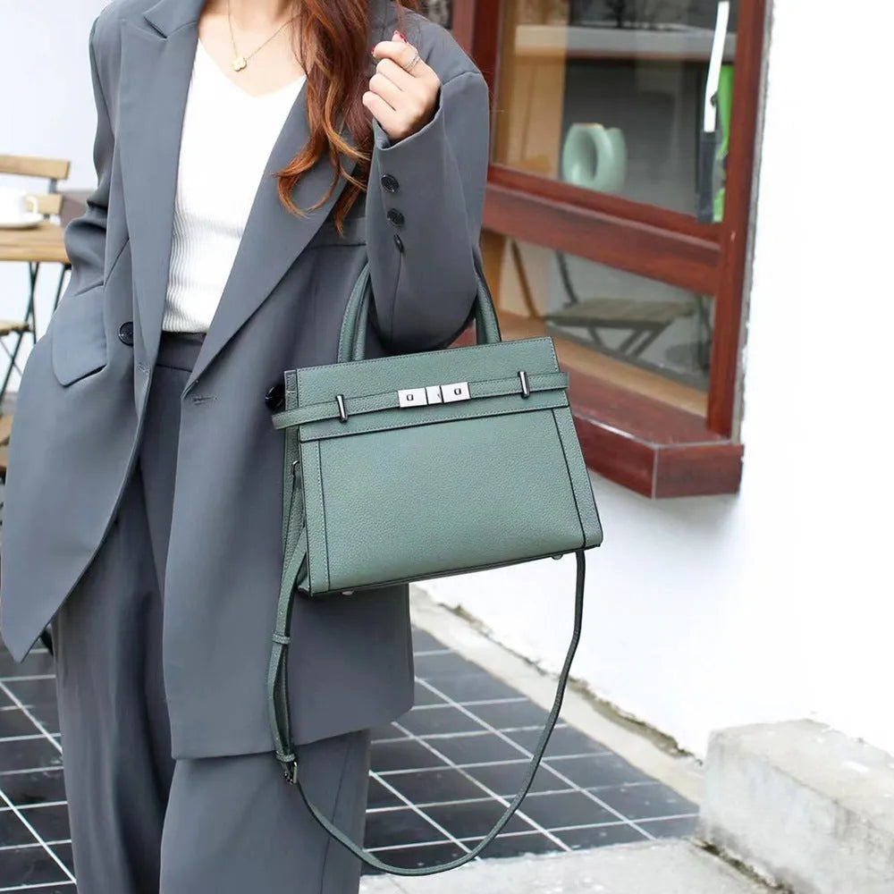 Small square genuine leather shoulder bag in almond green colour showing internal compartments