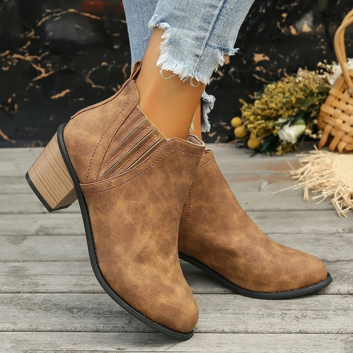 Women's black pointed toe ankle boots with thick square heel and slip-on design