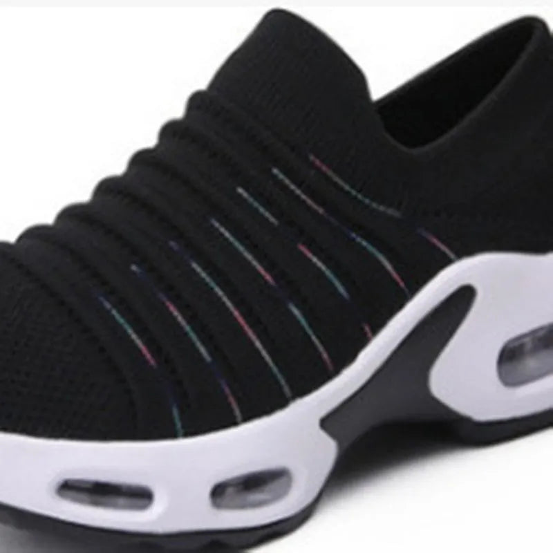 Women's plus size fly-knit socks shoes in mesh with low heel, shown in Tao Black colour.