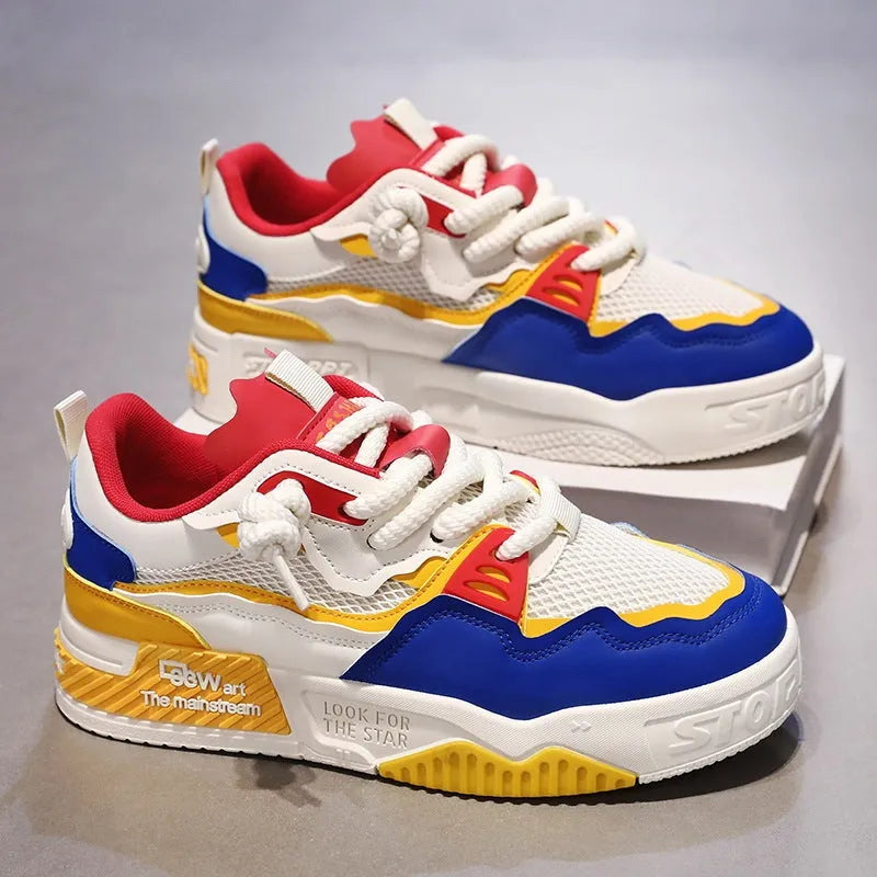 Men's white and yellow low-top board shoes with a rubber sole on a plain background.