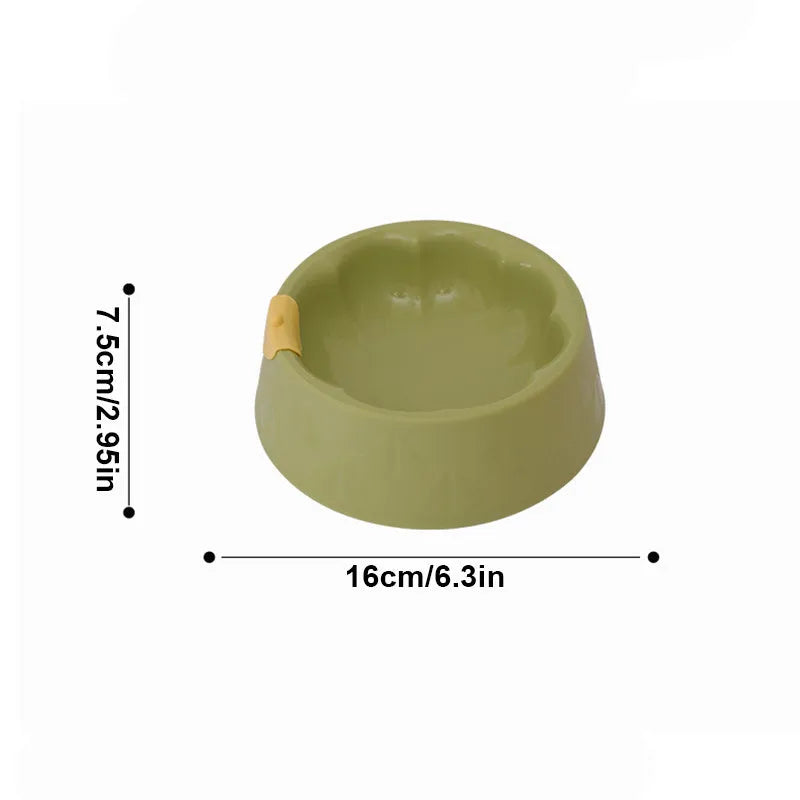 Green plastic double bowl for dog and cat food and water with anti-tip base.