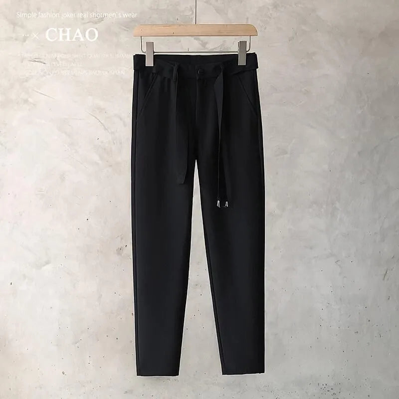Boys slim straight wool trousers in grey, showing tapered fit and straight leg opening.