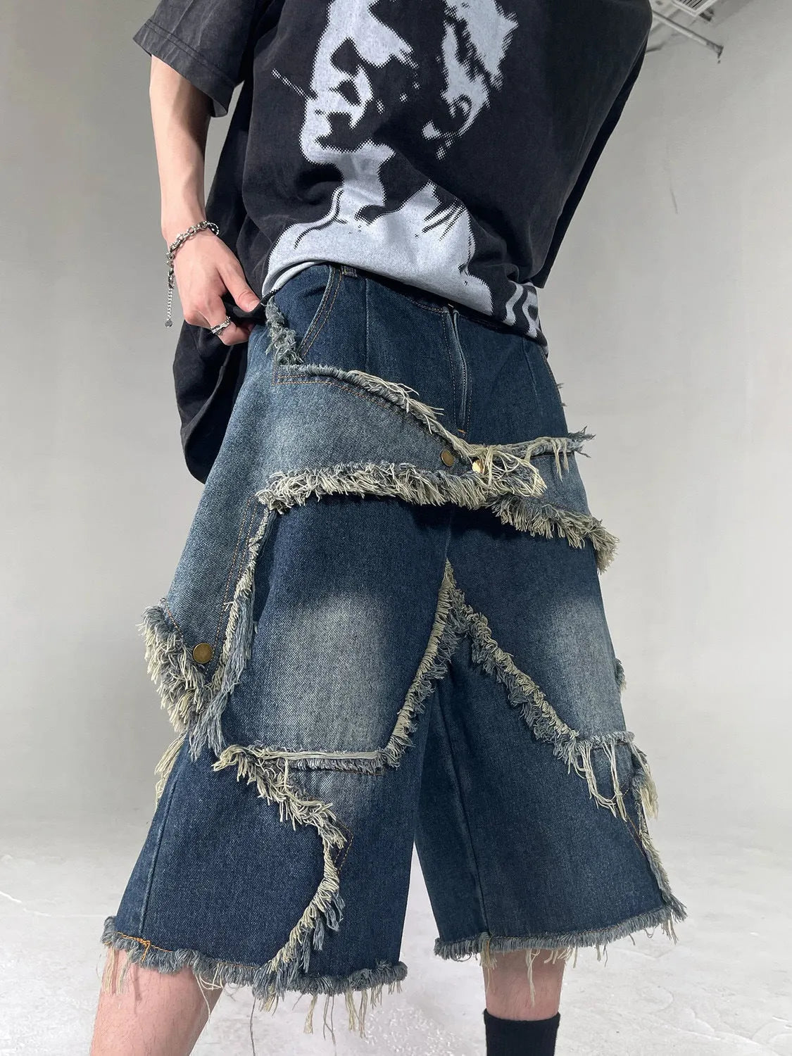 Blue men's denim shorts with frayed five-pointed star design and loose-fit summer styling