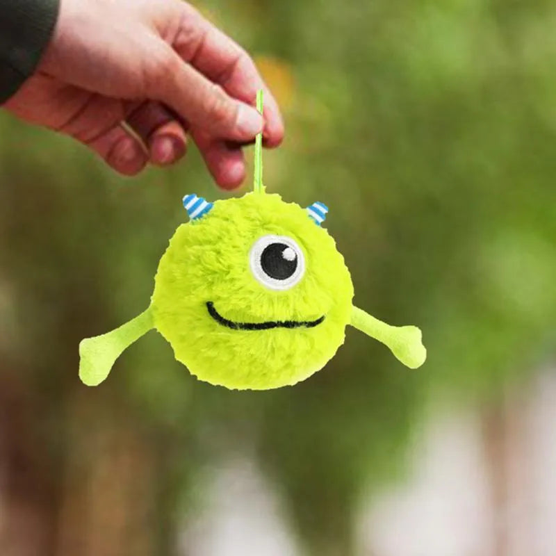 Green plush and TPR dog toy ball with sound interactive feature for teething puppies.