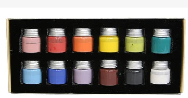 Pots of Morandi colour ceramic glaze paint in Lilac, Plant Ash, and Verdant for high temperature pottery firing.