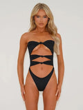 Women's nylon one-piece swimsuit with hollow out design, shown in available colours.