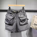Men's loose fit black casual shorts with pockets and straight leg hem.