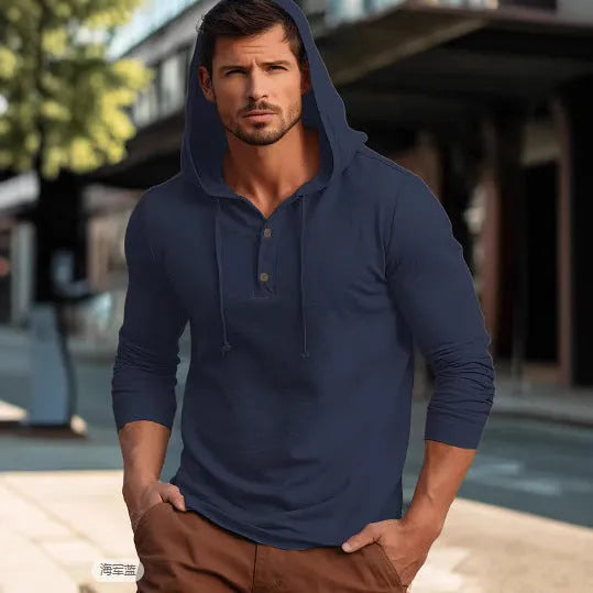Man wearing a dark blue casual cotton hoodie pullover with long sleeves.