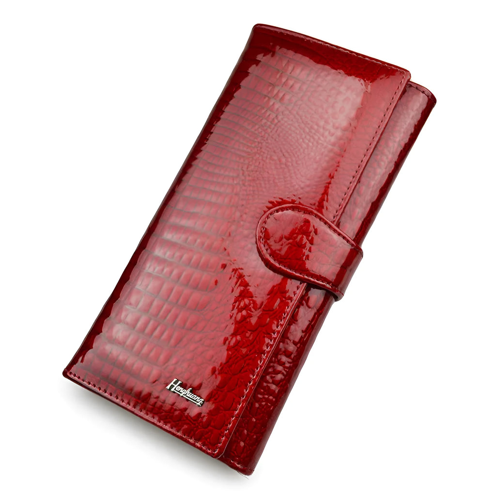 Women's leather coin purse with crocodile pattern embossing in red colour showing interior pigskin lining