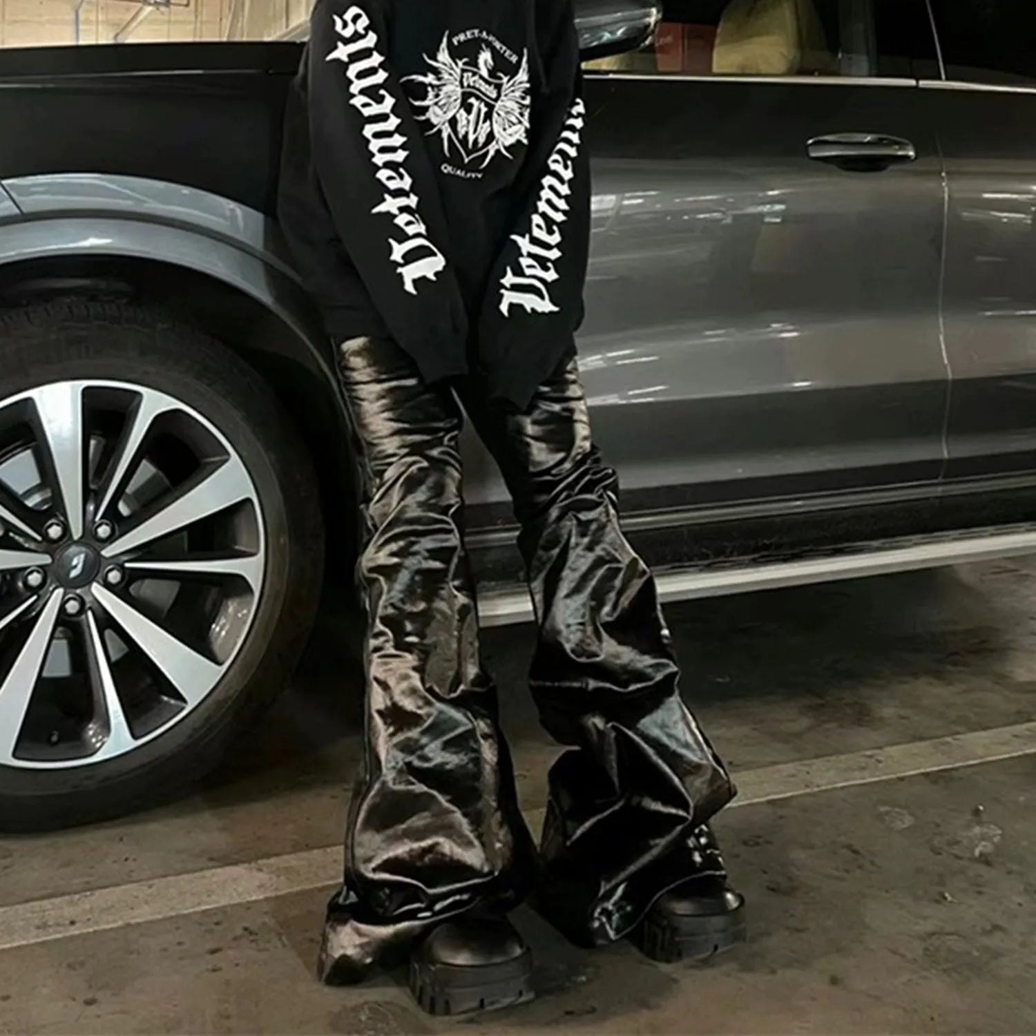 Black patent leather coated skinny jeans with straight-leg cut and mid waist design
