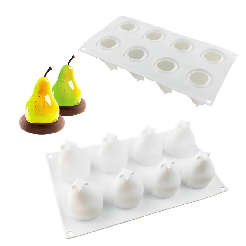 Flexible silicone baking mould with six cavities shaped like pineapple, pine cone, and pear fruit.