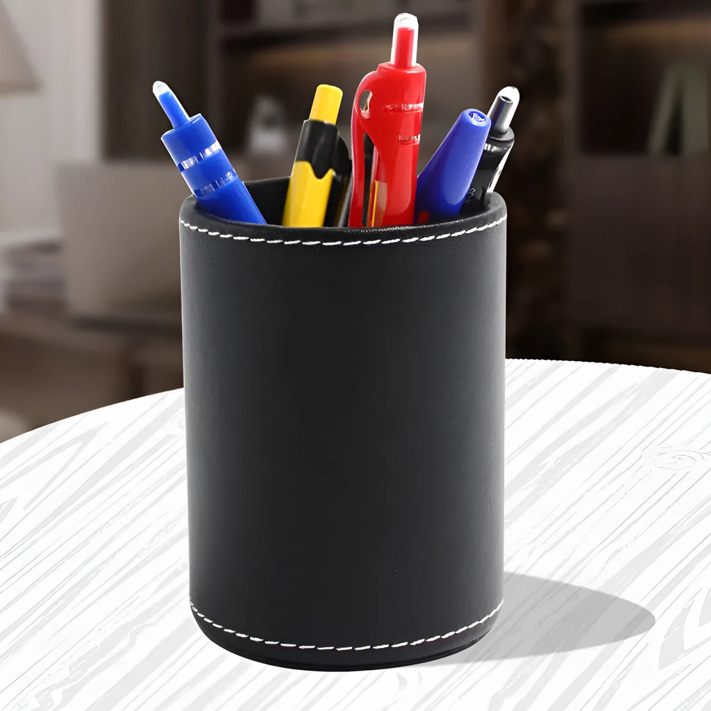 Round black leather pen holder container showing cylindrical shape and compact dimensions