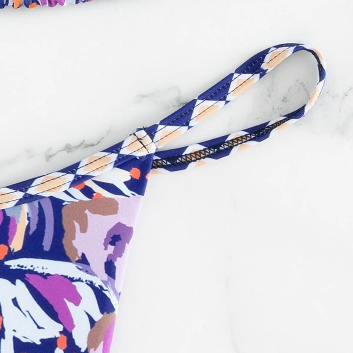 Women's floral print polyester swimsuit with triangle top and matching briefs