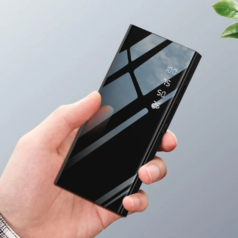 Black 20000mAh power bank with LCD display screen and dual USB ports.