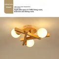 Wooden style ceiling lamp with three light heads in modern living room setting