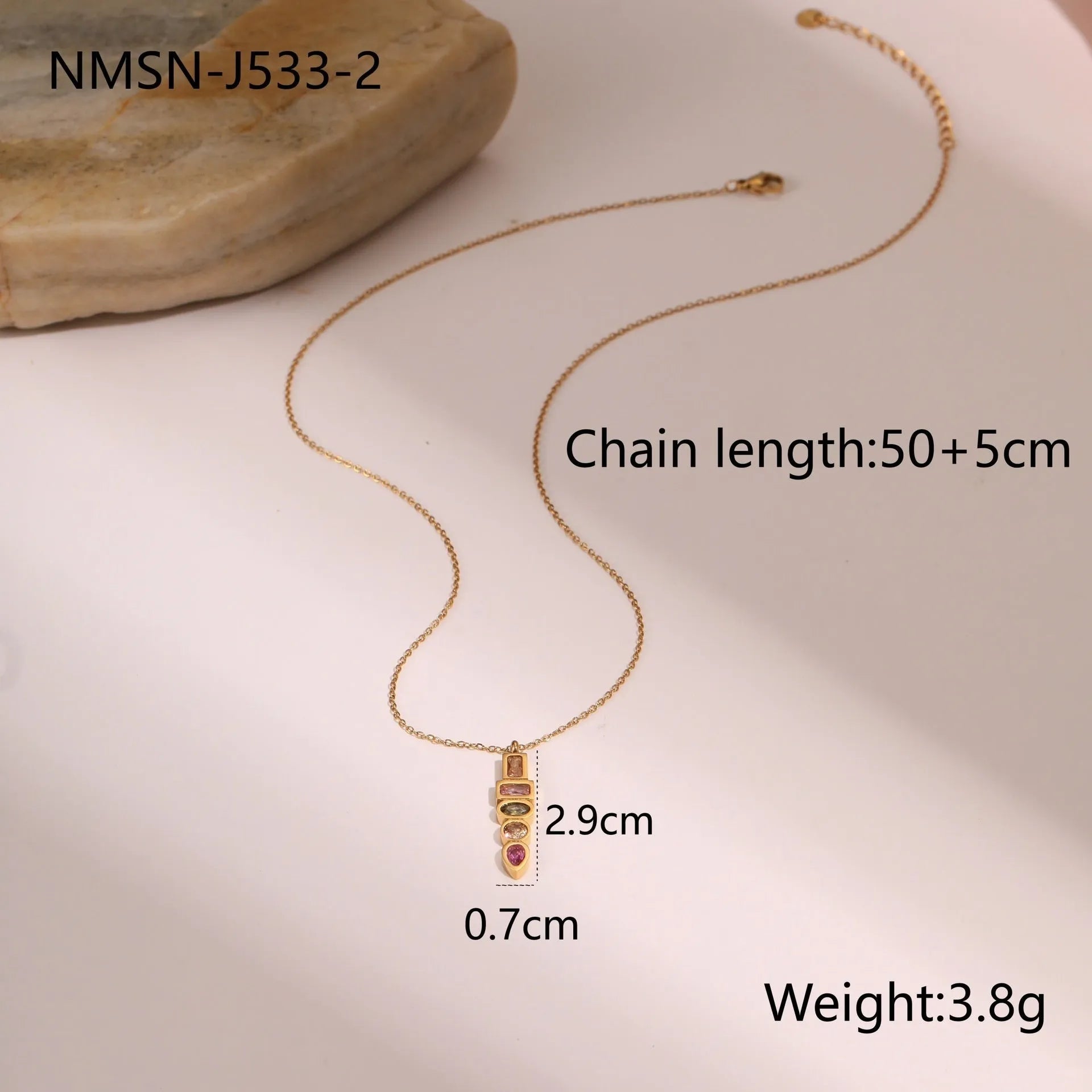 Geometric gold-plated zircon jewellery set showing necklace, ring and earrings with adjustable chain