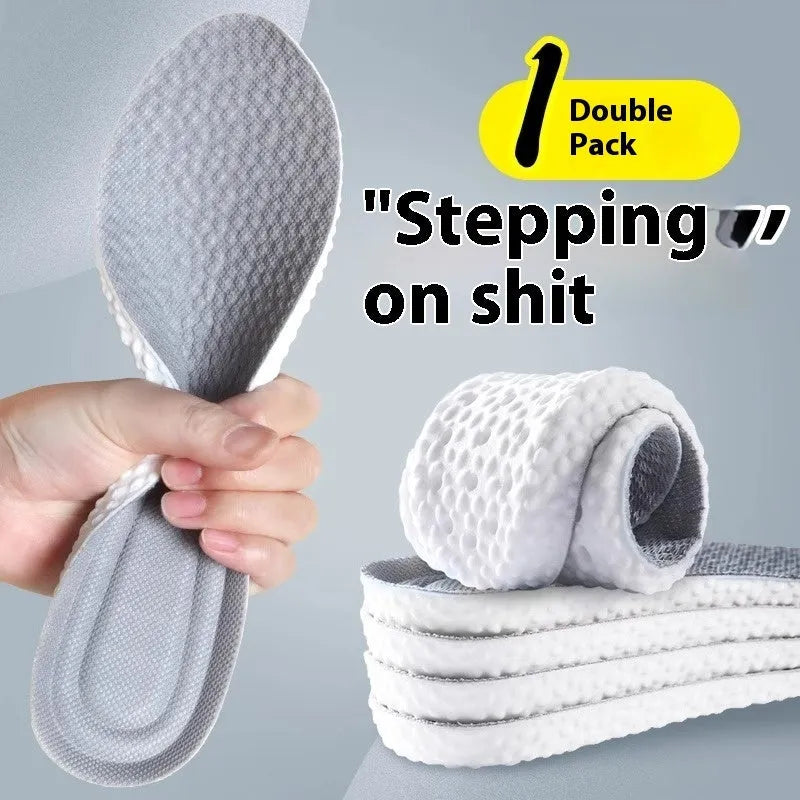A pair of breathable grey PU foam sports insoles on a white background, shown with scissors to indicate their cut-to-fit feature.
