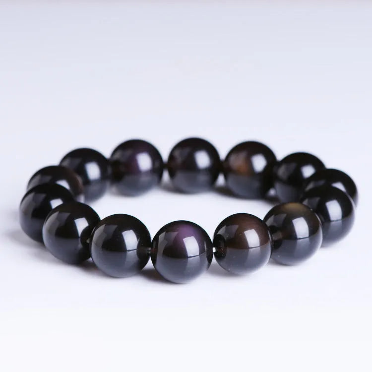Geometric Pi Xiu charm on a polished icy obsidian crystal bracelet for men and women.