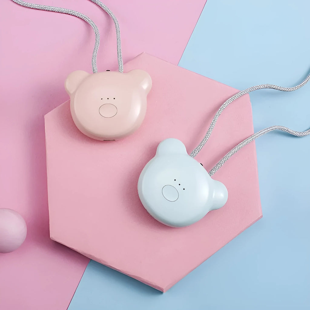 Pink and blue wearable USB air purifier necklace shown on a person, with dimensions 1.5 by 5.7 by 4.5 cm.