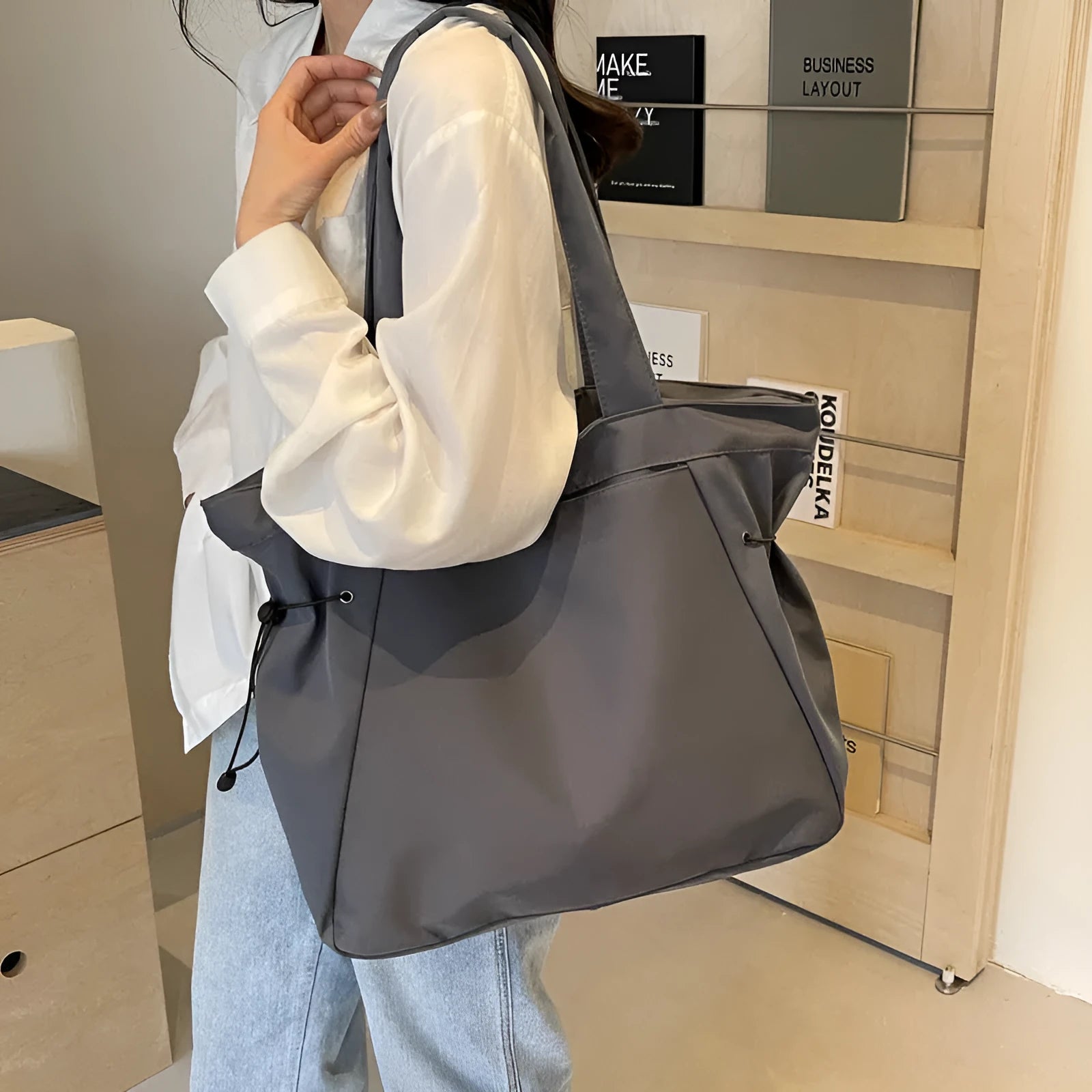 Soft foldable Oxford cloth commuter shoulder tote bag in street trend style.