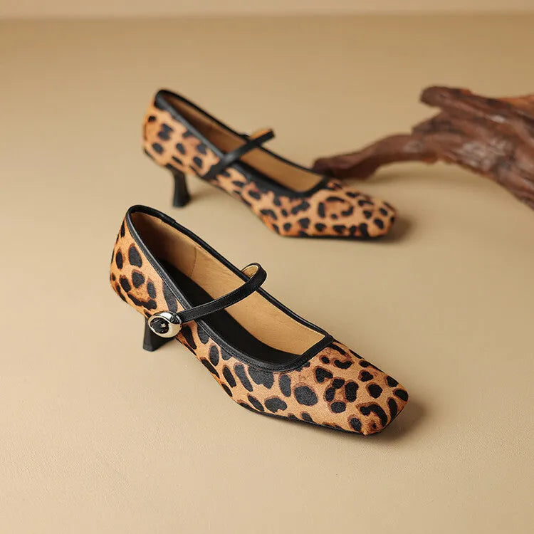 Women's black square toe stiletto ankle-strap shoes with horse hair upper and buckle closure.