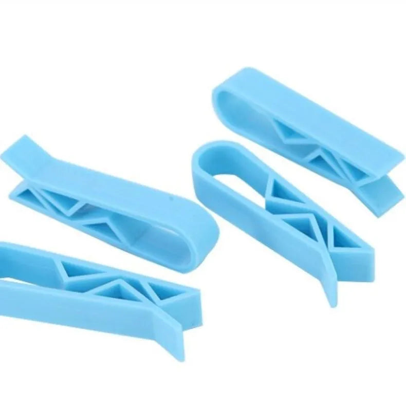Non-slip plastic fixing clip for holding rubbish bags onto the side of a bin.