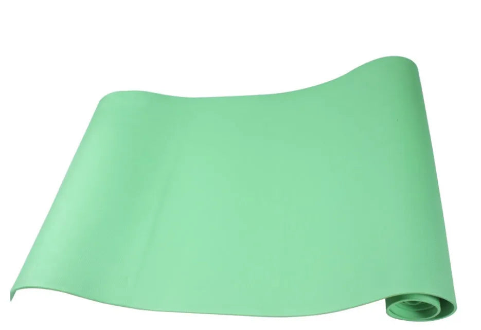 Red EVA fitness yoga mat showing texture and thickness, rolled partially with carry bag.