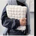 Large black nylon laptop bag with cloud cotton interior, shown open to reveal storage compartments.