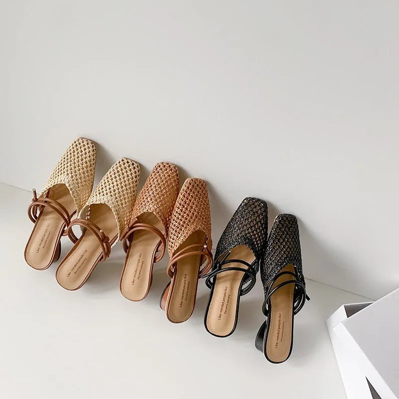 Women's black French-style outdoor slippers with hollow-out design and a thick square chunky heel.
