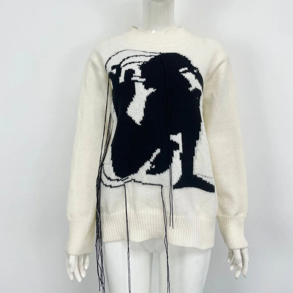 Women's loose grey alpaca wool sweater with tassel detailing and abstract pattern