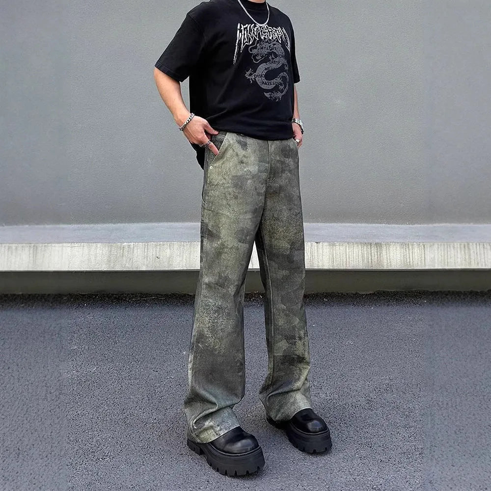 Men's straight-leg jeans with a retro digital camouflage pattern on blue denim.