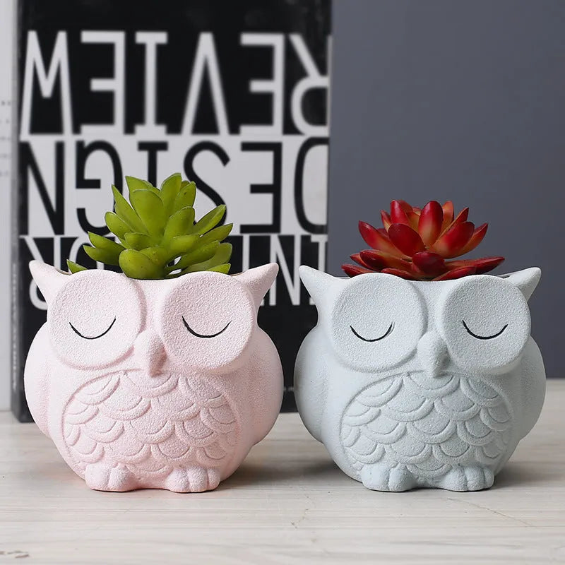 Handmade ceramic owl-design succulent pot in frosted light pink, white, green, or blue, measuring 11cm by 9cm.