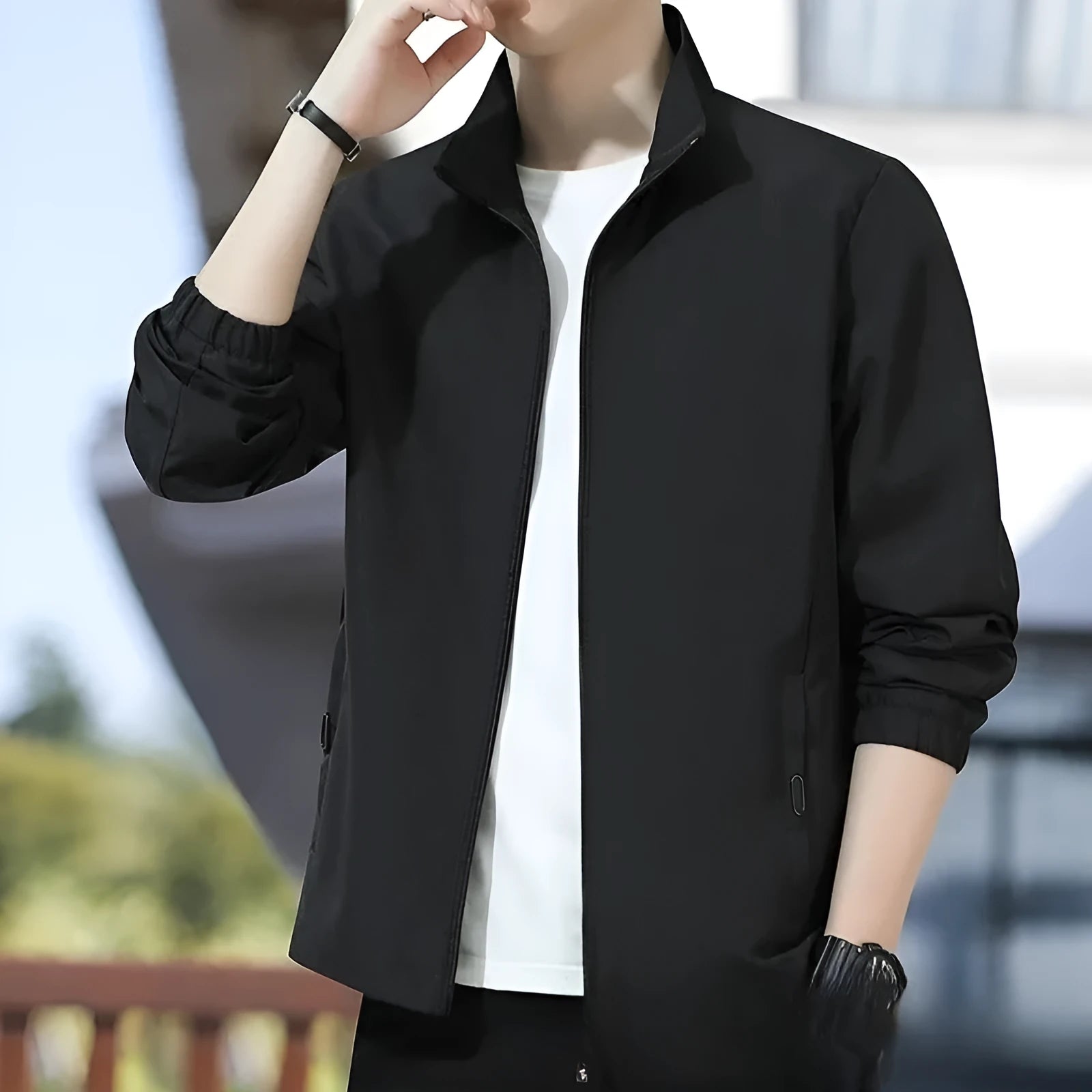 Man wearing a black Korean-style loose lapel casual jacket with zipper pockets