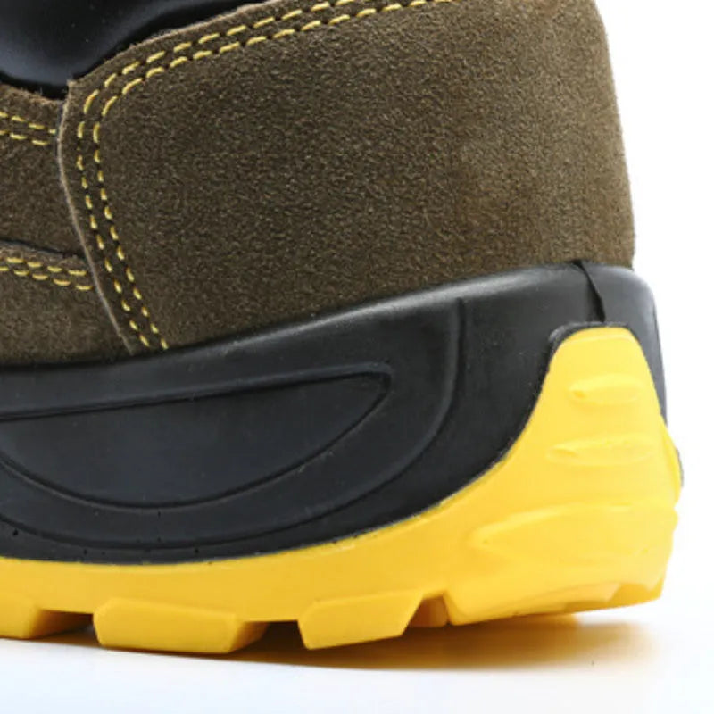 Bronze coloured low-cut cow suede safety work boots with a steel toe cap on a grey background