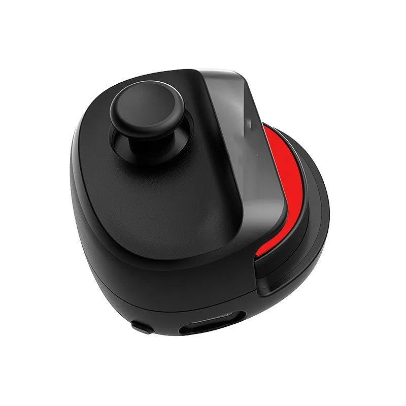 Black USB game stick controller with compact dimensions on gaming desk